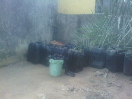 Jerrycans used to scoop petrol
