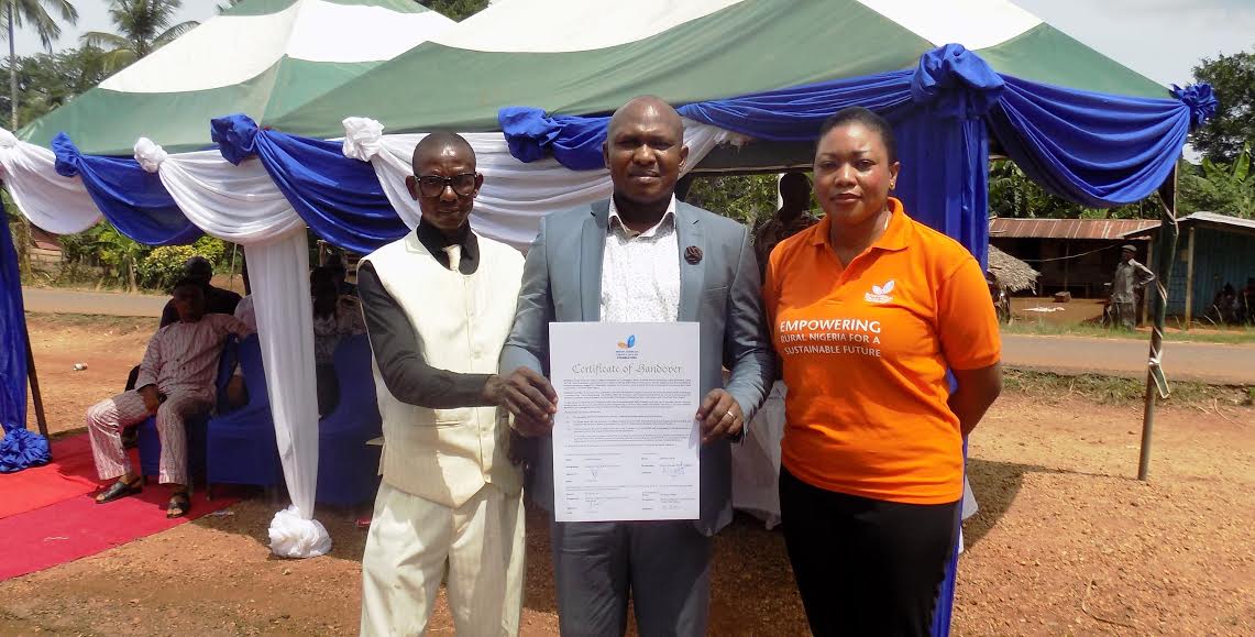 L-R: Pastor Erim Etta; and Honourable Lawrence Takor receiving the certificate of handover from Abimbola Okoya, General Manager, British American Tobacco Nigerian Foundation(BATNFduring the commissioning of the Solar-powered Borehole at Akparabong Community, Ikom Local Government Area of Cross River State by BATN Foundation.