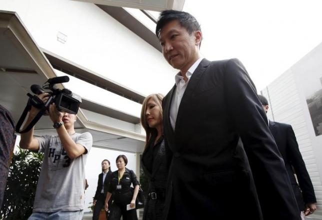 City Harvest Church founder Kong Hee and his wife Sun Ho, also known as Ho Yeow Sun, arrive at the State Courts in Singapore