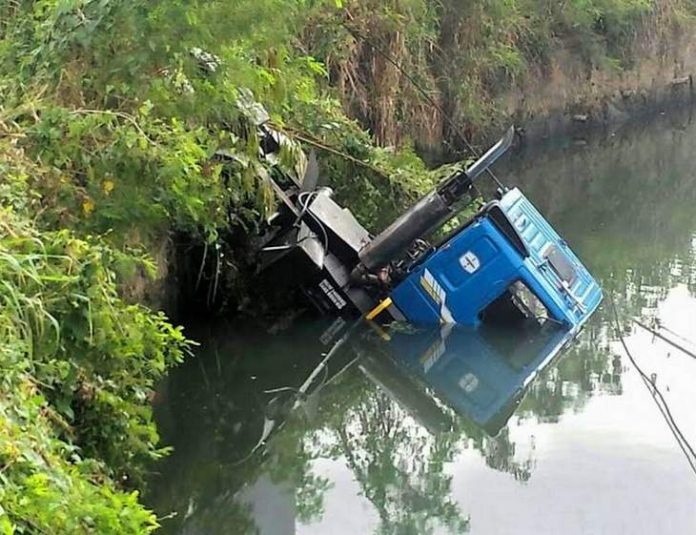 truck plunges into river